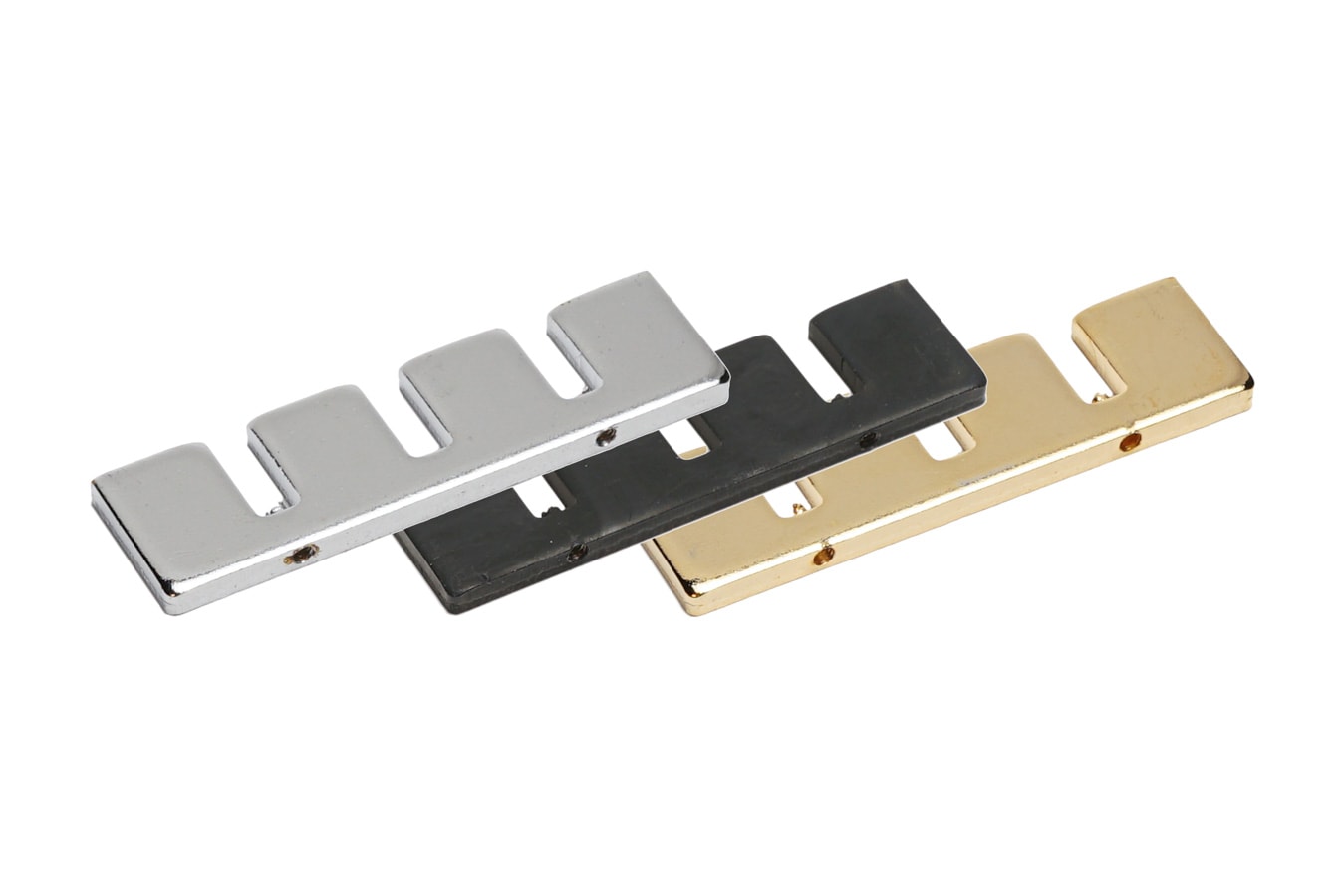 Three rectangular metal plates with four rectangular cutouts each in silver, black, and gold finish.