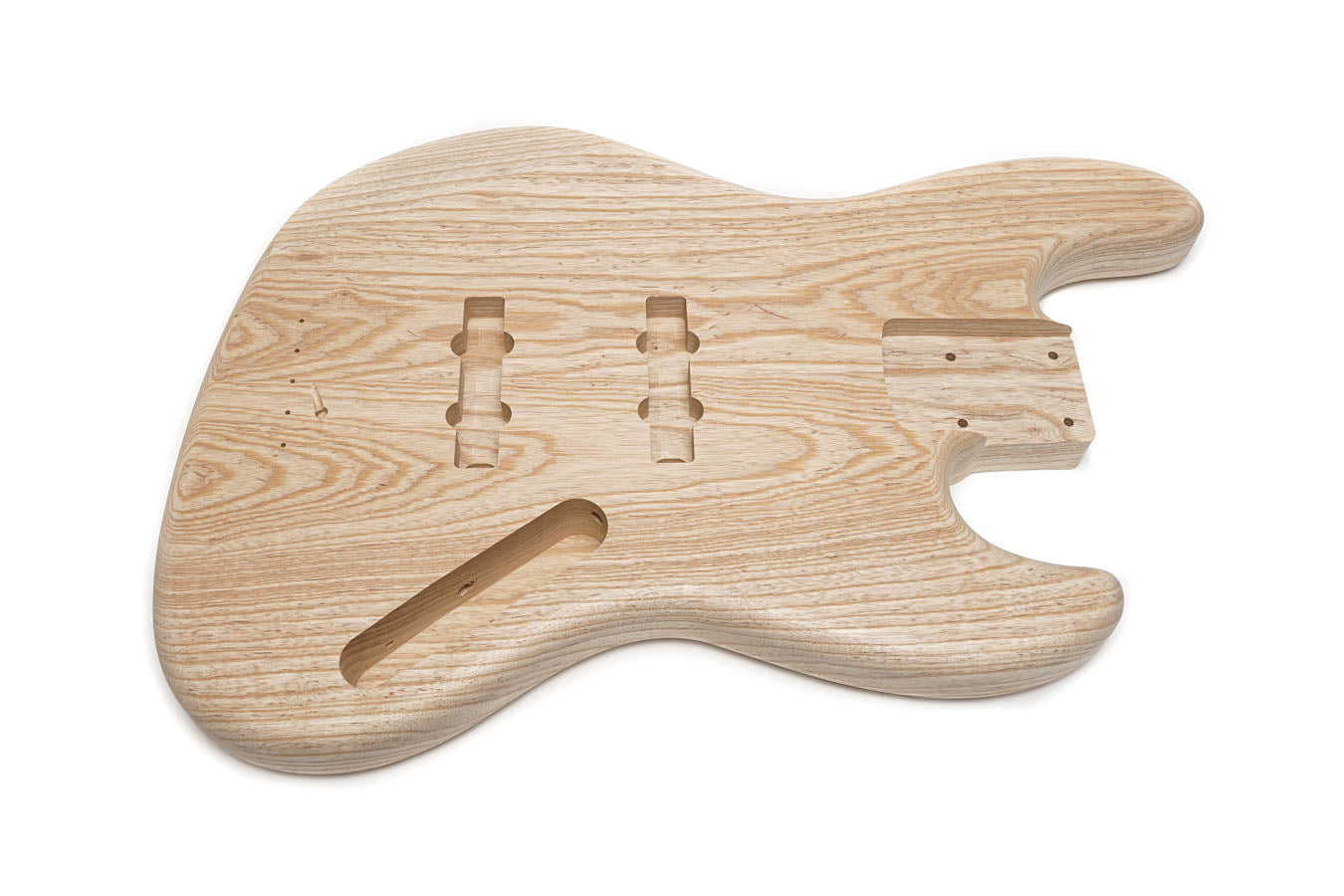 Unfinished natural wood bass guitar body with cutouts for pickups and controls