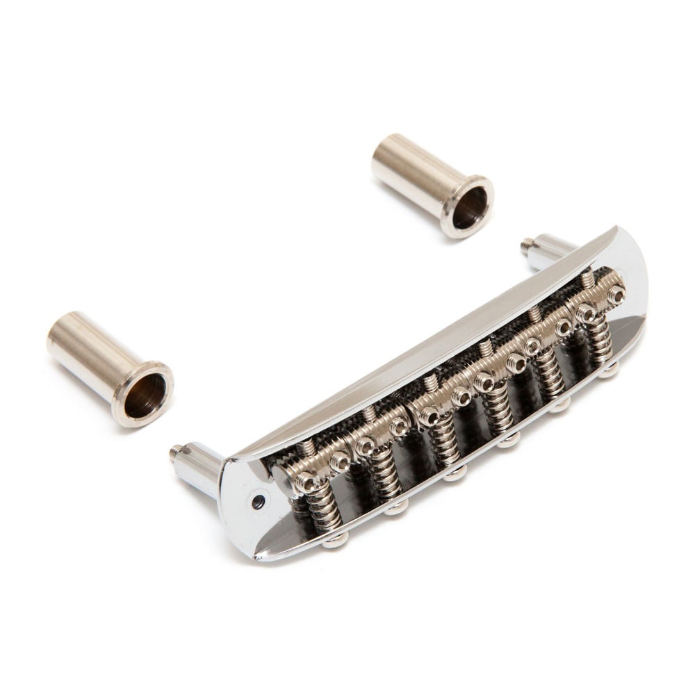 Chrome guitar bridge with adjustable screws and two separate metal mounting posts on a white background.