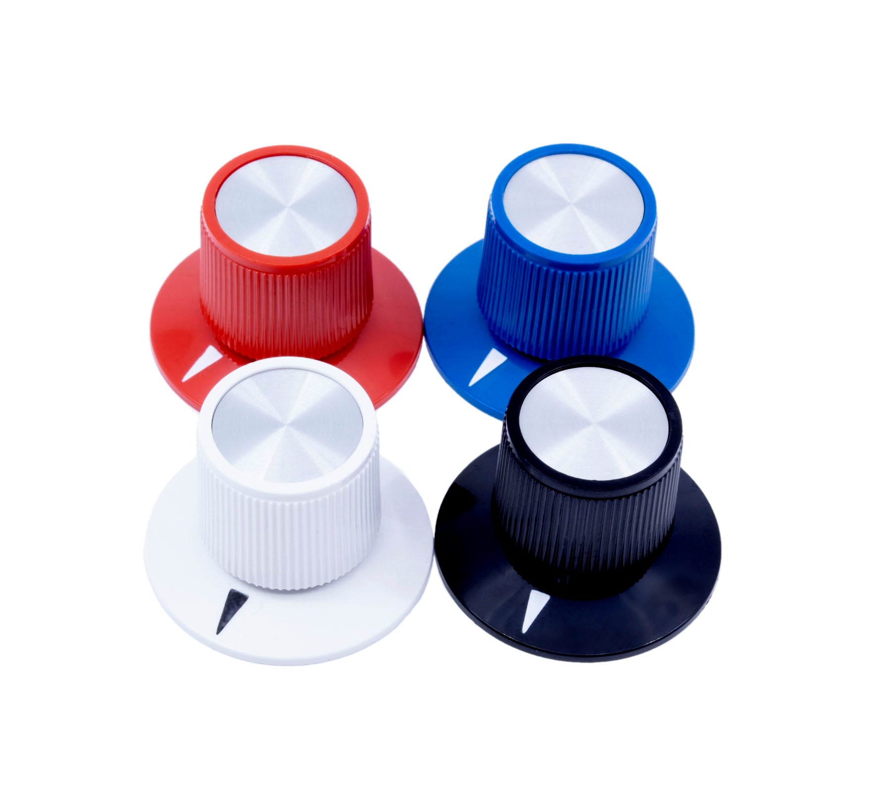 Four medium skirted control knobs in red, blue, white, and black with metallic tops and pointer marks.
