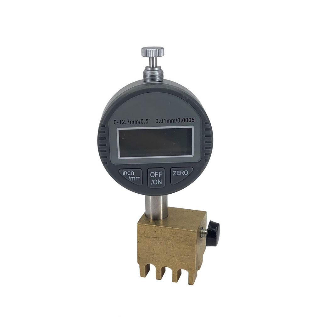 Digital measuring gauge with a brass forked base and a round display with three function buttons.