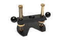 Black metal base part with two black ball knob handles, gold threaded screws, and springs