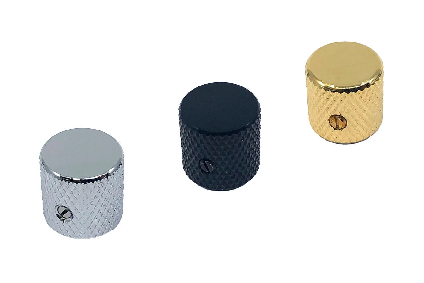 Three metal knurled flat top knobs in silver, black, and gold colors arranged in a row.