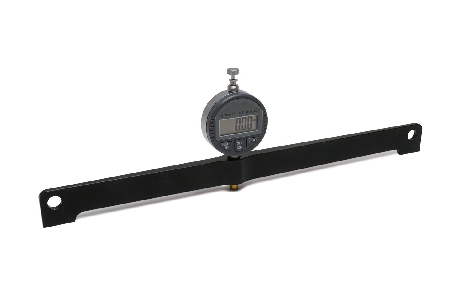 Digital dial gauge mounted on a black metal bar with holes on both ends against white background.