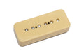 Cream-colored rectangular guitar pickup with six metal pole screws visible on top.