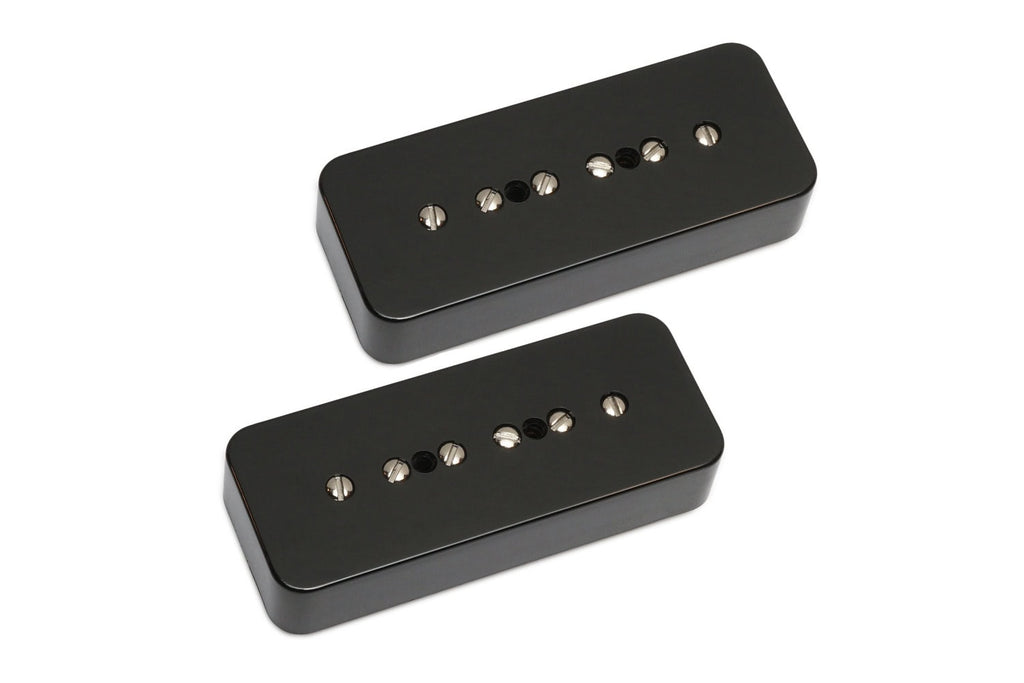 Two black rectangular guitar pickups with six adjustable screws each on a white background.