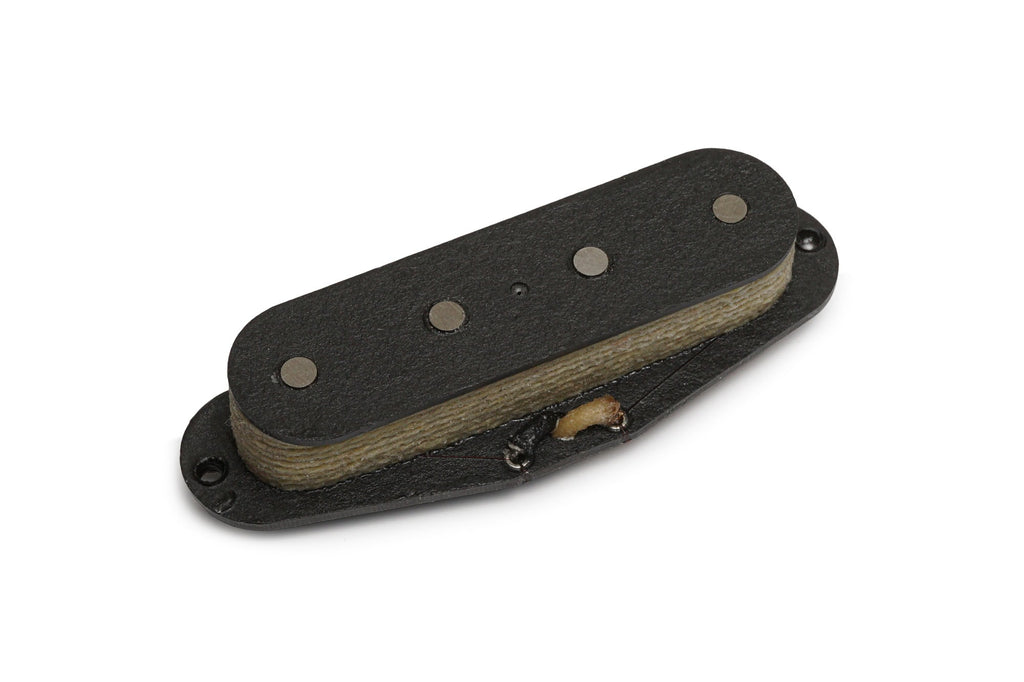 Black rectangular guitar pickup with four round pole pieces and cloth-wrapped wire on a white background.