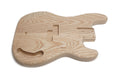 Unfinished natural wood bass guitar body with pickup and control cavities visible.