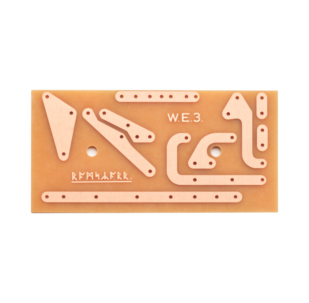 Top view of a brown printed circuit board with copper traces and two mounting holes.