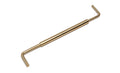 A gold metal measurement gauge tool with two L-shaped ends and a cylindrical center piece.
