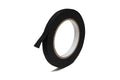 Roll of black fabric tape with a partially loose end against a white background.