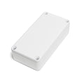 Small white rectangular metal enclosure with a closed lid and four corner screws visible.