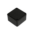 Small black rectangular plastic enclosure box with a lid secured by four screws at the corners.