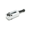 Silver metal guitar saddle with two adjustment screws and a black spring-loaded screw.