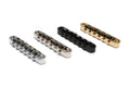 Four metal roller saddles arranged side by side in silver, nickel, black, and gold finishes on white background.