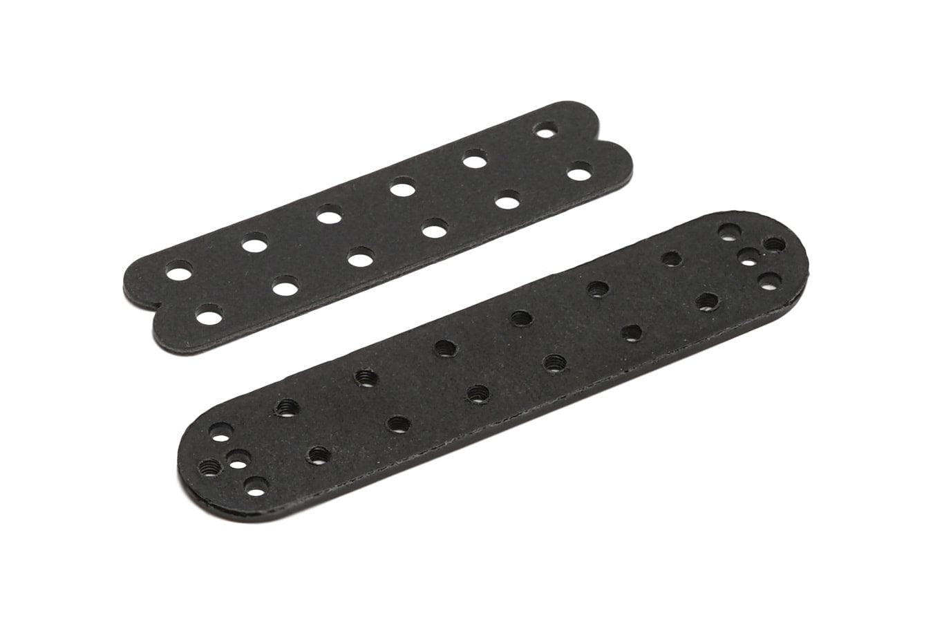 Two black flat metal plates with multiple holes arranged in rows on a white background.