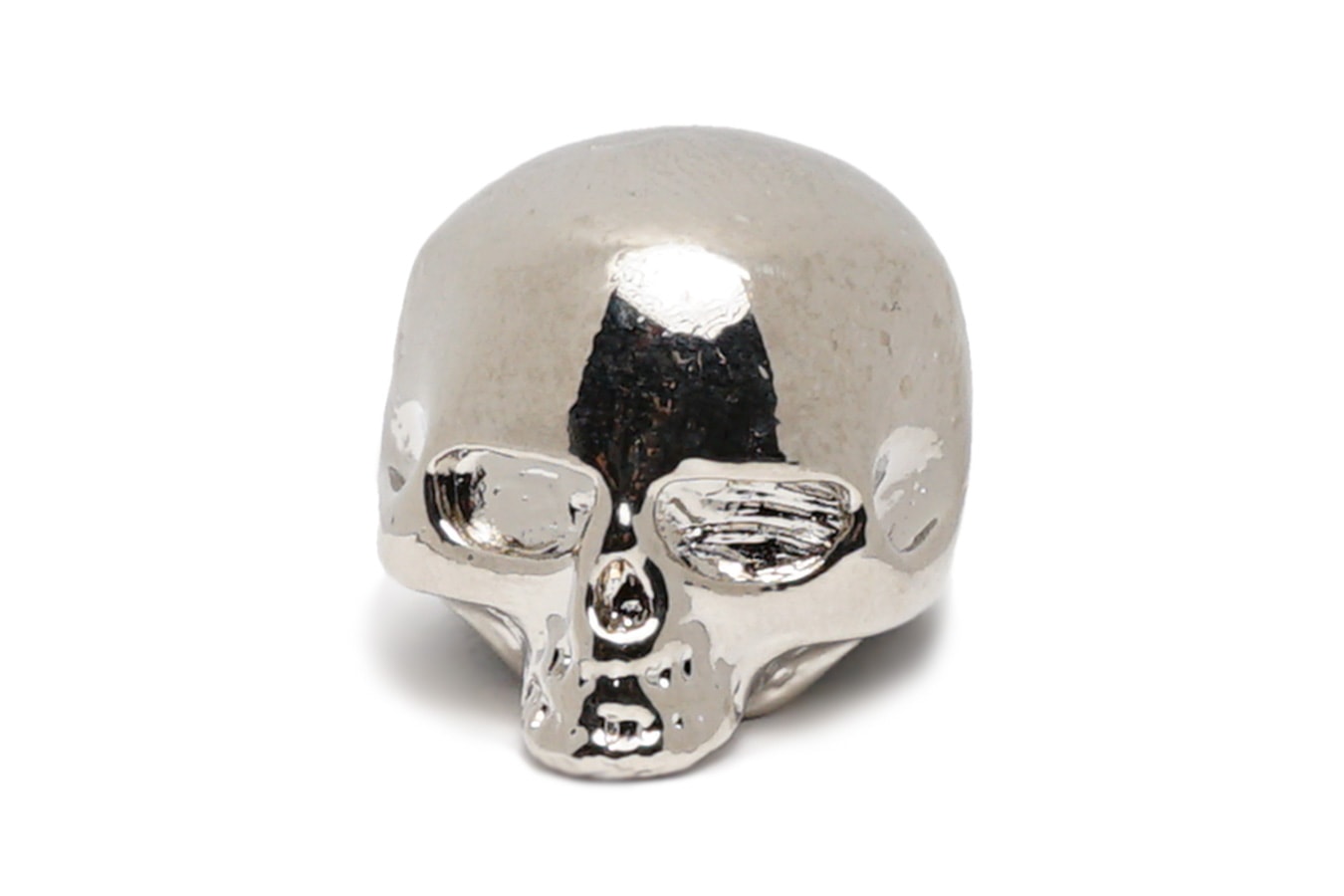 Polished silver metal skull-shaped knob viewed from the front on a white background.