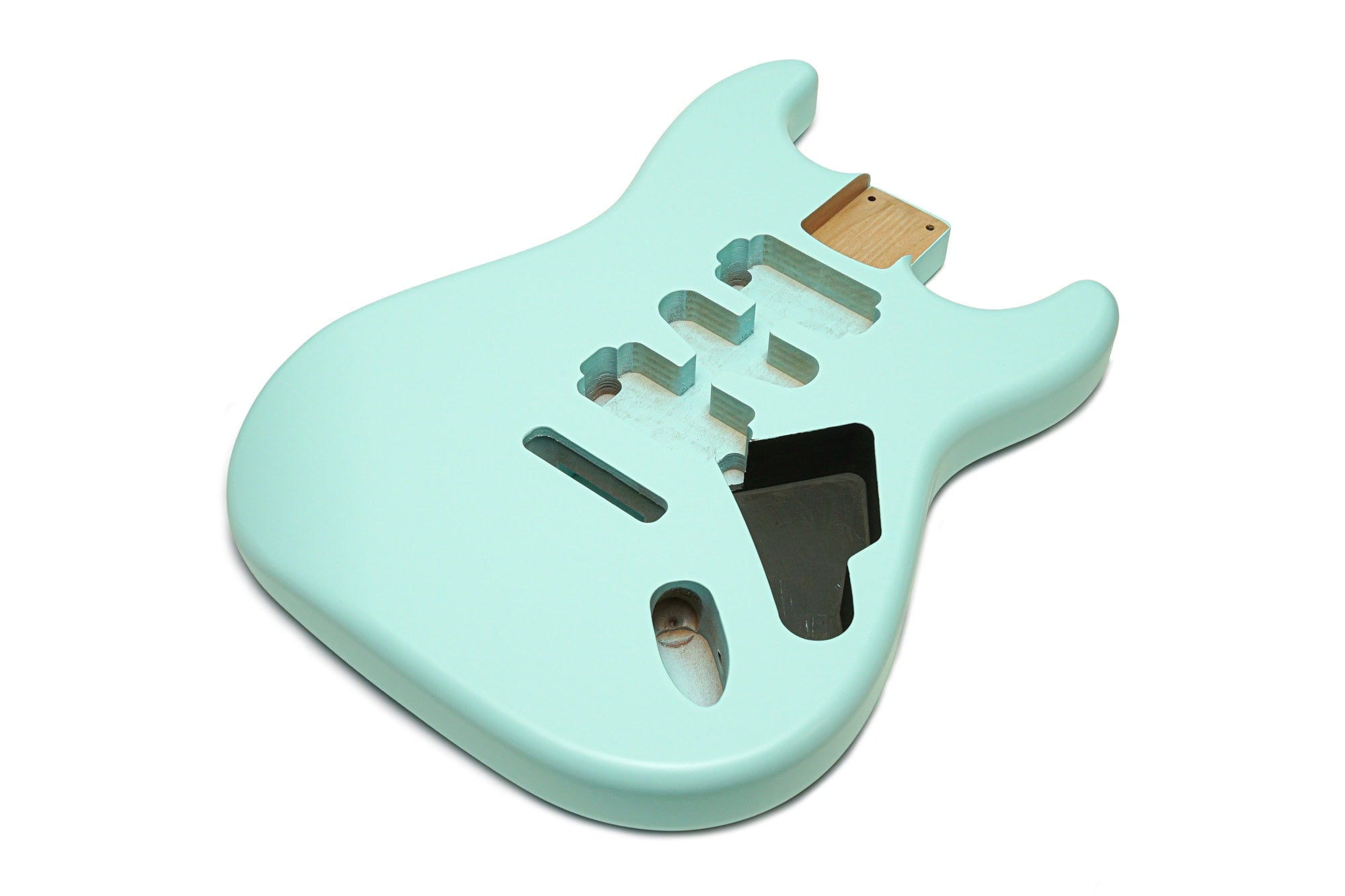 Pastel blue guitar body with routed cavities for pickups and controls on a white background.