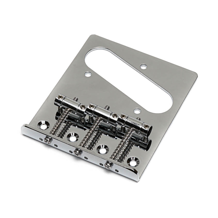 Chrome metal guitar bridge plate with four screw holes and three adjustable saddles.