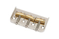 Metal guitar bridge with three gold saddles and adjustment screws on a silver base plate.