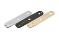 Three metal control plates in silver, black, and gold with slots and holes for guitar switches and controls.
