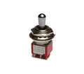 Metal toggle switch with red plastic housing and pin terminals on a white background.