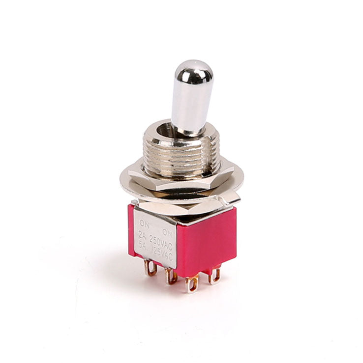 A metal toggle switch with red plastic base and six pin terminals, labeled with electrical ratings.