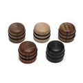 Five wooden dome-shaped knobs in different wood finishes with rubber rings, arranged on a white background.