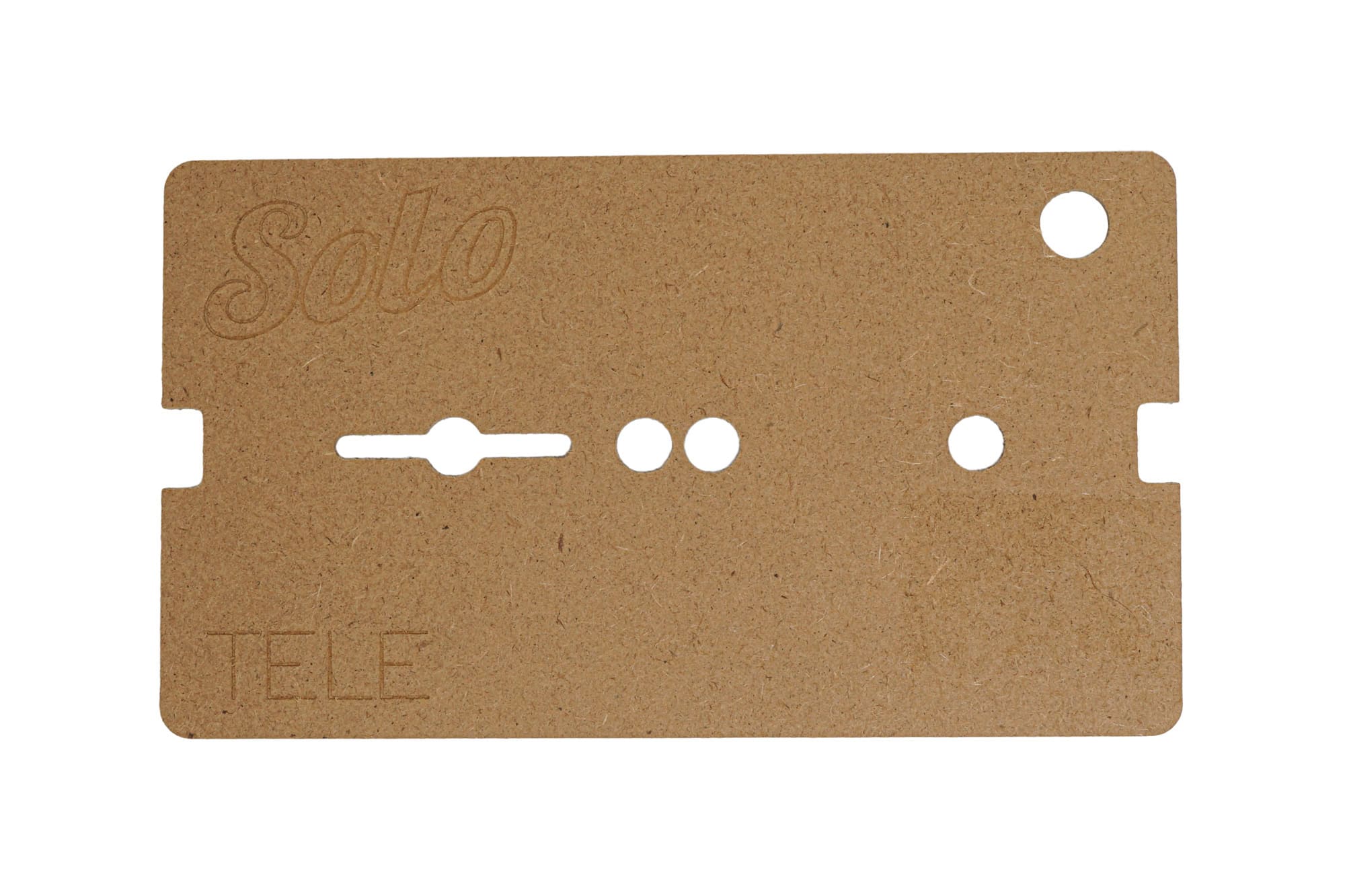 Brown fiberboard template card with cutouts and embossed text Solo and TELE.
