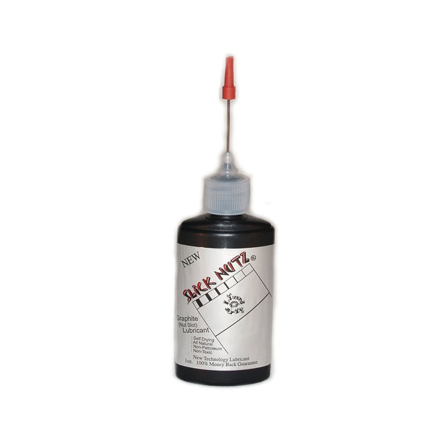 Black plastic bottle with needle dispenser labeled Slick Nutz Graphite Nut Slot lubricant 1 oz.
