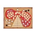 Top view of a wooden-cased synthesizer with red and beige artistic design and multiple knobs and audio jacks.