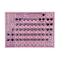 Pink electronic drum machine with multiple knobs, switches, and audio jacks visible on front panel.