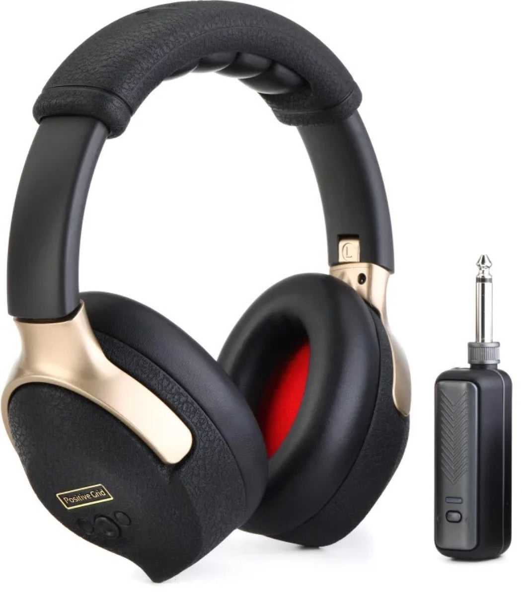 Black and gold over-ear headphones with a wireless transmitter featuring a 1/4 inch plug.
