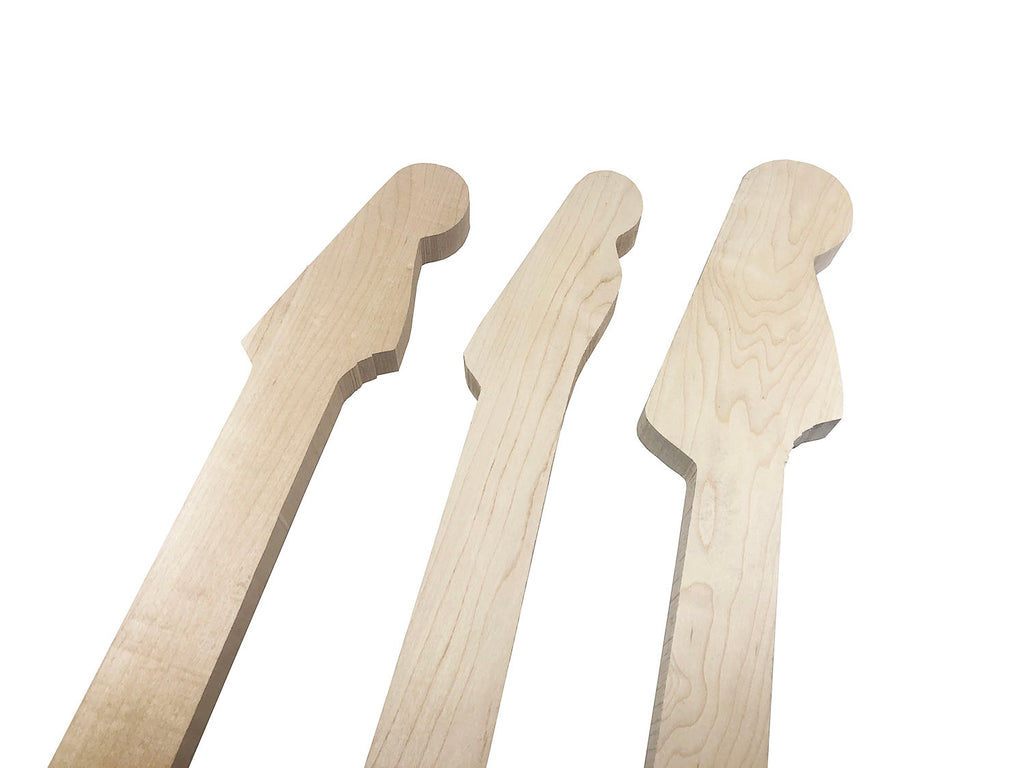 Three unfinished wooden guitar neck blanks with different headstock shapes against a white background.