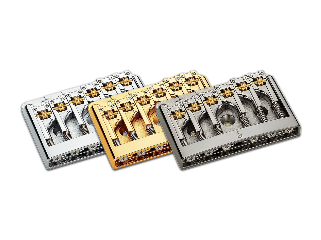 Three metal 6-string guitar bridges in silver, gold, and chrome finish shown side by side.