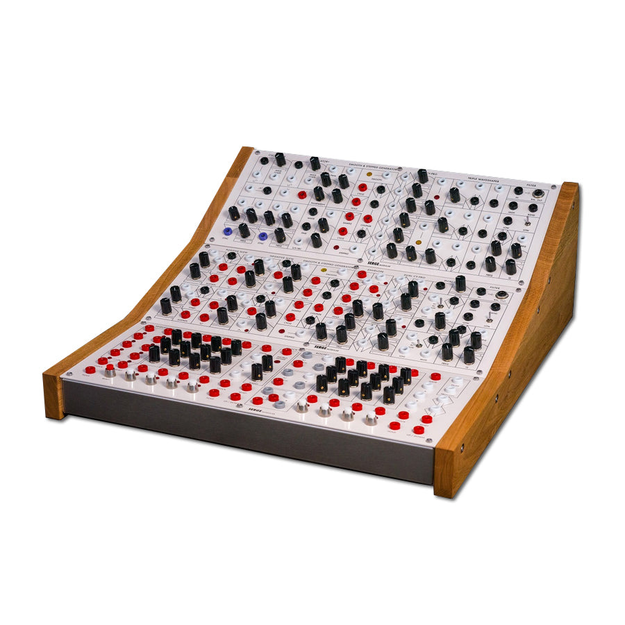 White modular synthesizer with wood side panels featuring multiple knobs, buttons, and patch jacks arranged in three rows.