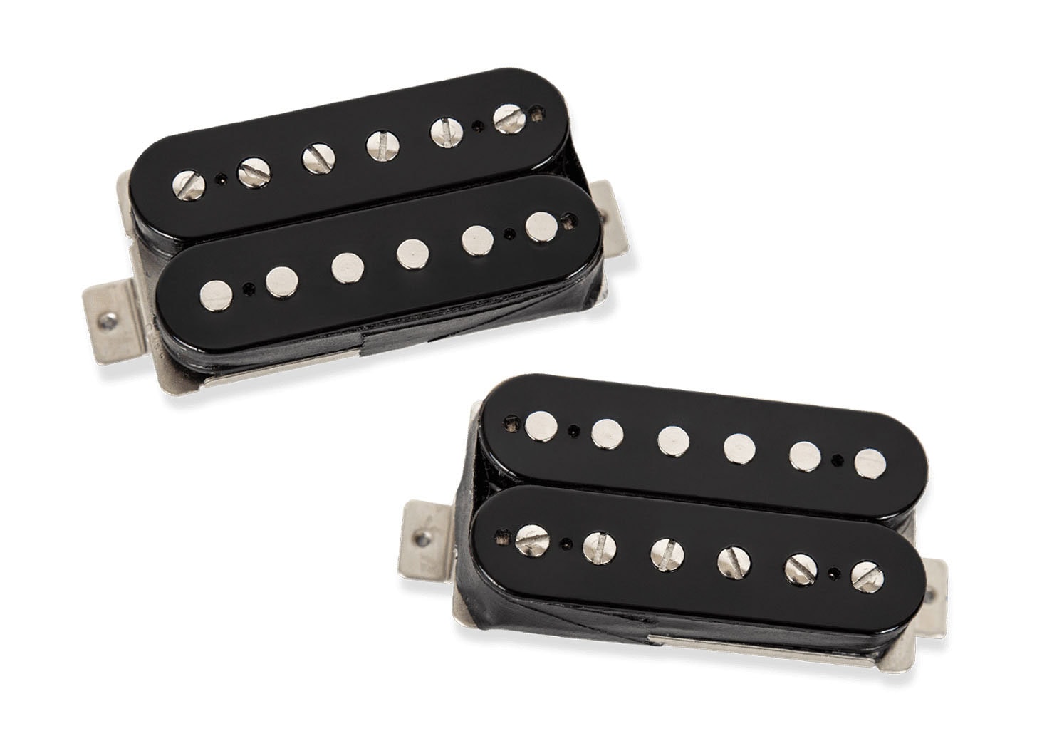 Two black humbucker pickups for electric guitar with metal mounting tabs on a white background.