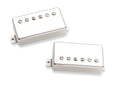 Two rectangular metal guitar humbucker pickups with six adjustable pole screws each and mounting tabs