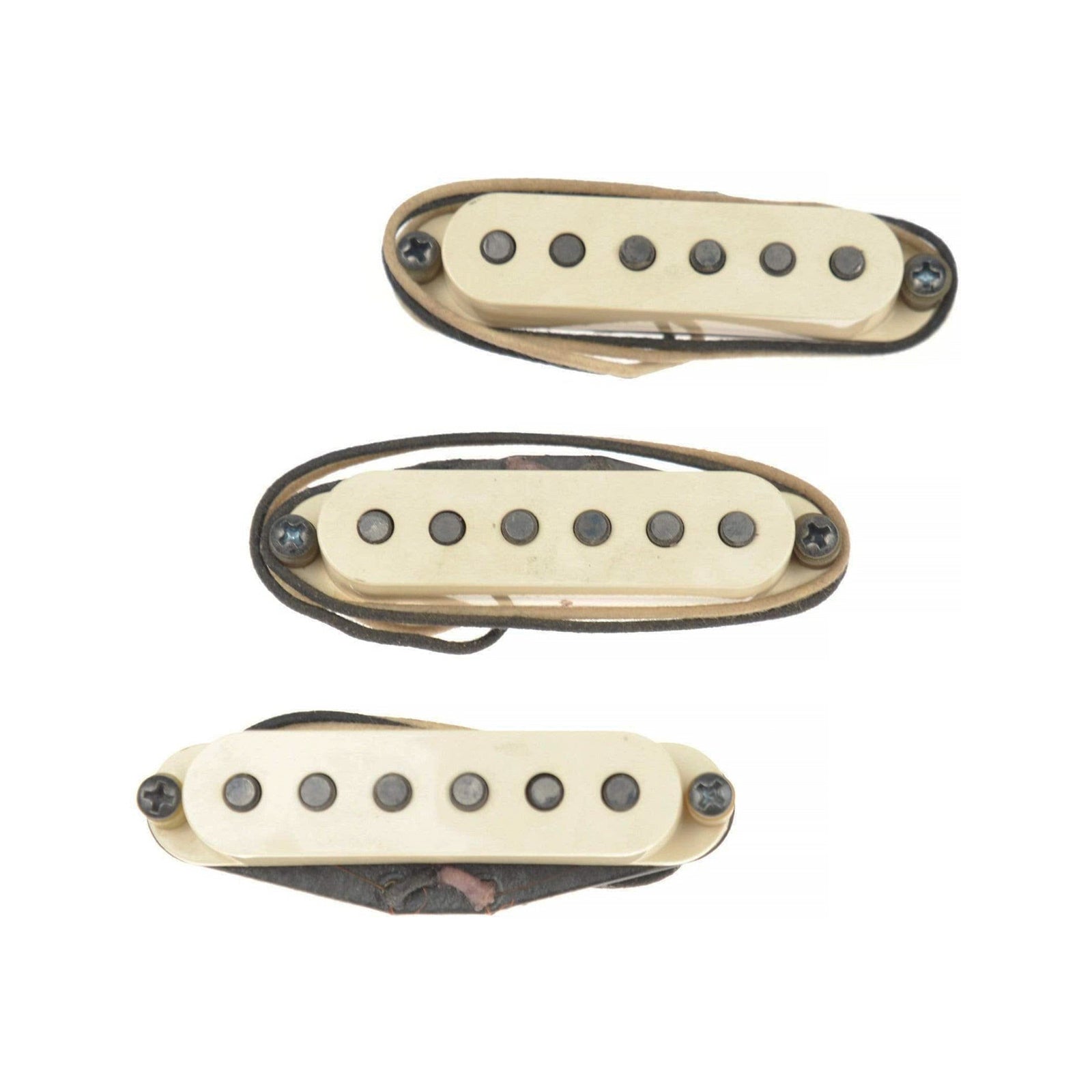 Three off-white single coil guitar pickups with six pole pieces each and attached wire leads.