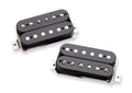 Two black electric guitar humbucker pickups with metal mounting brackets on a white background.