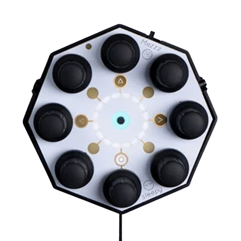 Octagonal synthesizer with eight black knobs on a white surface and a wired cable attached
