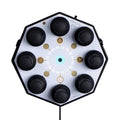 Octagonal synthesizer with eight black knobs on a white surface and a wired cable attached