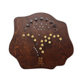 Dark wood electronic device with multiple silver and gold knobs and the words SOMA TERRA on its surface.