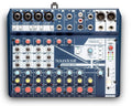Top view of a blue Soundcraft Notepad-12FX audio mixer with multiple inputs, knobs, faders, and USB port.