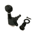 Black guitar tuning peg with washer and screw on a white background.