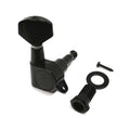 Black guitar tuner with mounting screw, washer, and bushing displayed on white background.