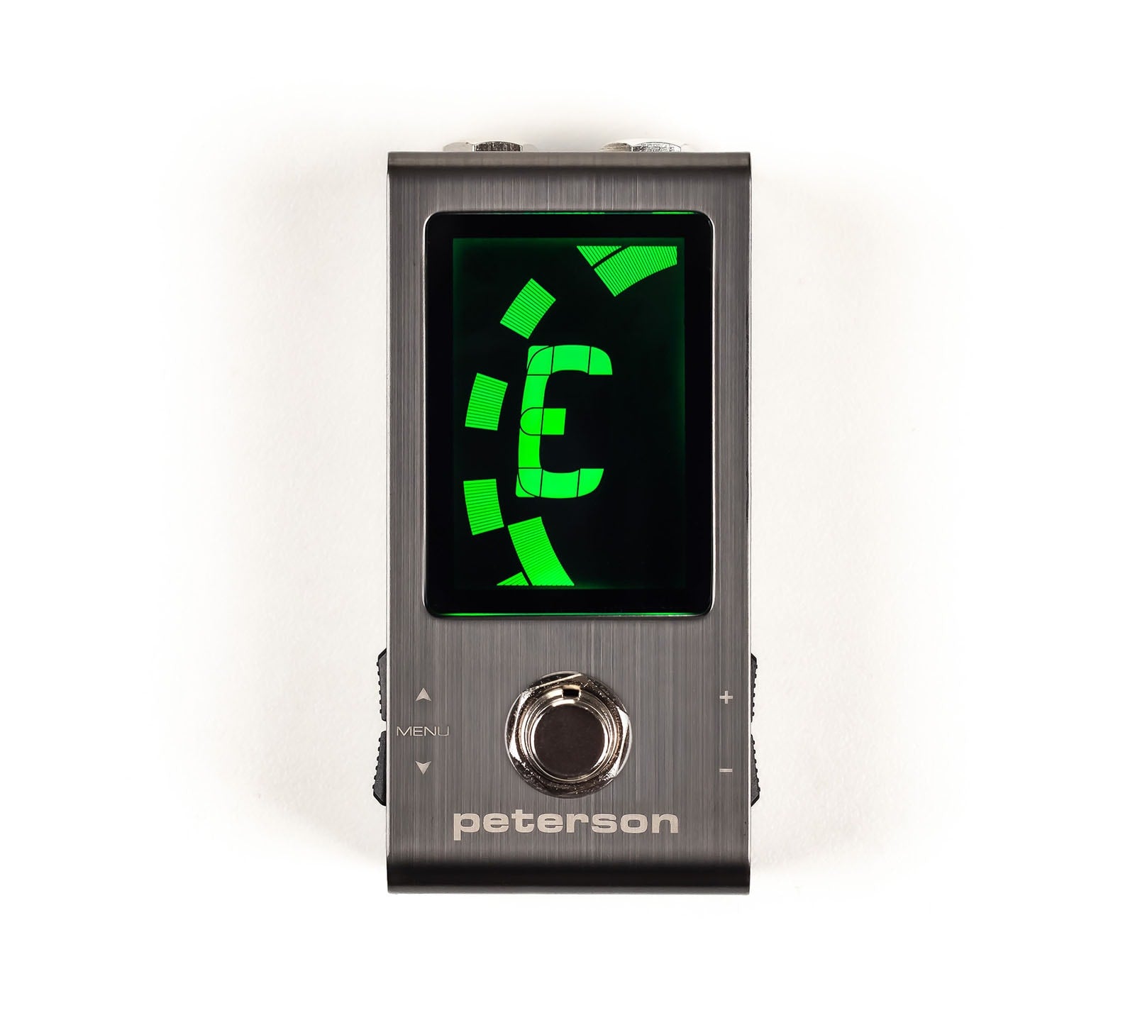 Black compact pedal tuner with green digital display and single footswitch labeled Peterson.