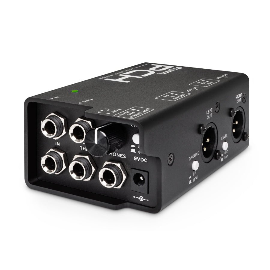 Black audio interface box with 1/4 inch jacks, XLR outputs, knob, switches, and 9V power input.