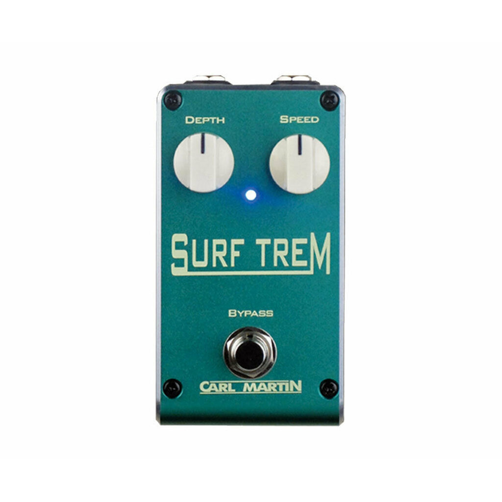 Teal Carl Martin Surf Trem guitar effects pedal with two white knobs, one footswitch, and an LED indicator.