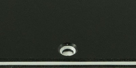 Close-up view of a black and white 3-ply layered material with a round hole.